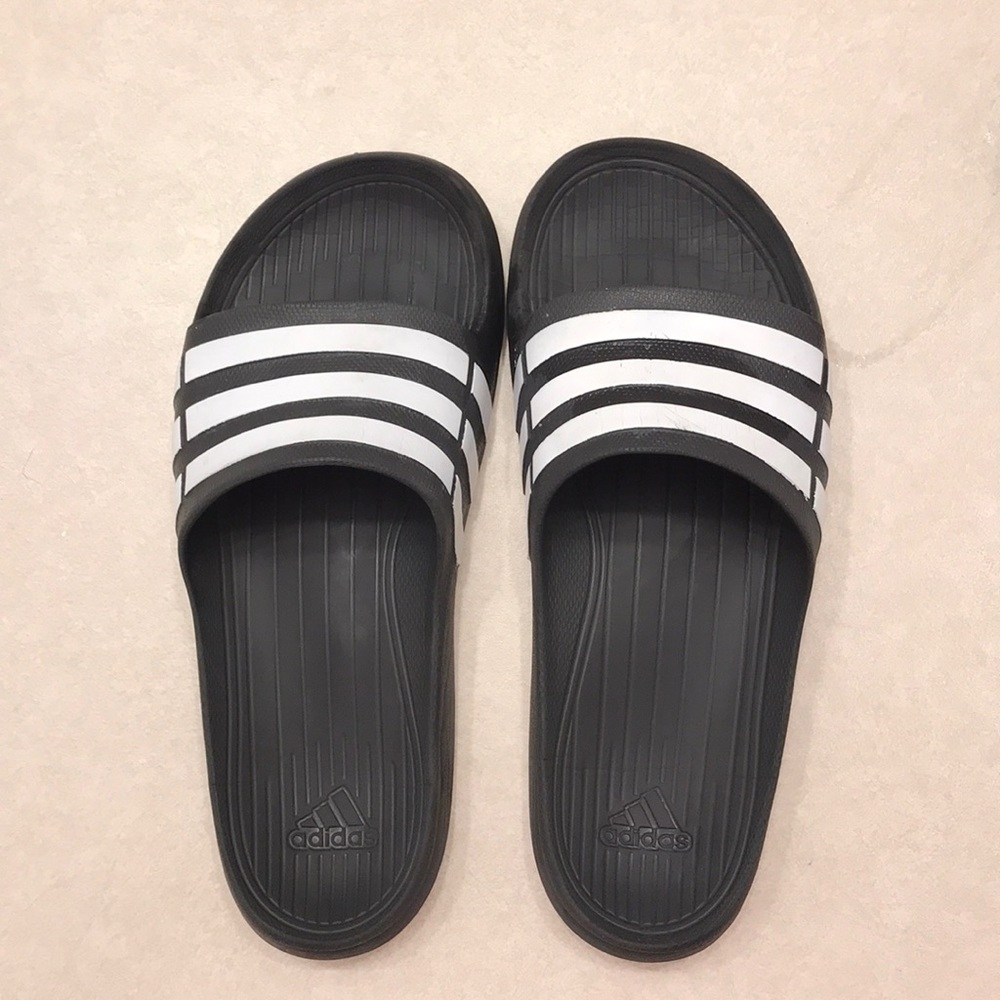 Black adidas slides